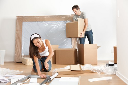 Workers using lifting equipment during removals