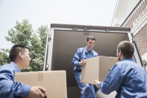 Van service helping with a local move in London street