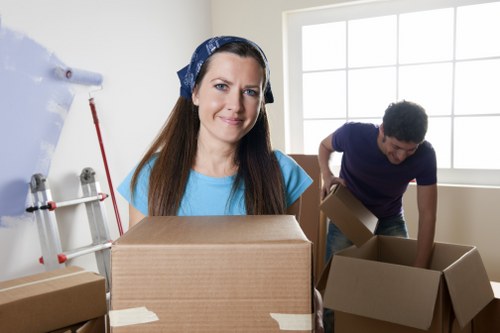 A moving team unloading boxes at a London home