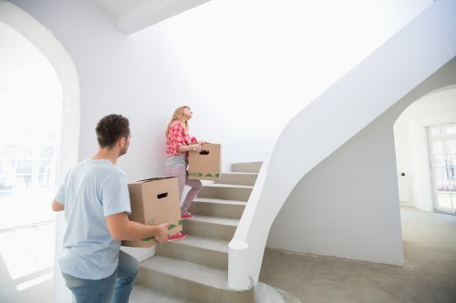 Professional movers handling a flat removal in a London street